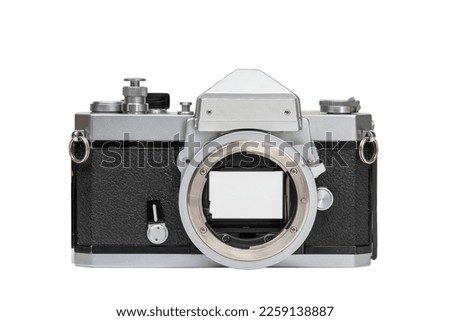 With lens and camera back removed, viewer can see how instant return mirror rises to expose the shutterfilm, and how the shutter opens to allow image to reach film frame.