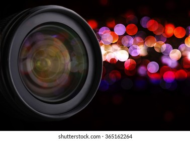 Lens of camera on abstract night background, close up