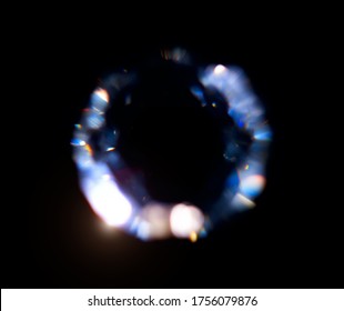 Lens Flare, Abstract Bokeh Lights. Leaking Reflection of a Glass, Diamond, Crystal. Jewelry. Defocused Shining round shaped Colorful rainbow Light Leaks, Rays on Black Background