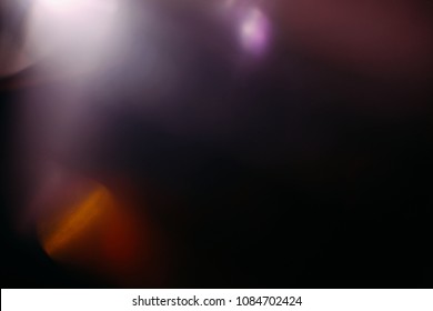 lens flare colorful abstract light glow black. optical abstract flash. black background