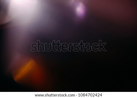 lens flare colorful abstract light glow black. optical abstract flash. black background