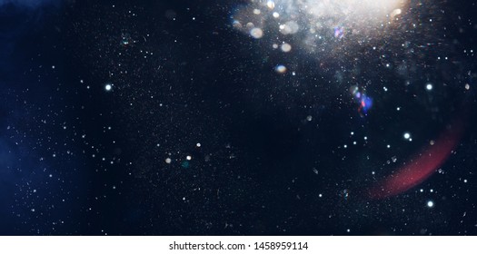 Lens Flare. Light over black background. Easy to add overlay or screen filter over photos. Abstract sun burst with digital lens flare background. Gleams rounded and hexagonal shapes, rainbow halo. - Shutterstock ID 1458959114