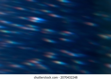 Lens Flare Overlay. Blur Light Flecks. Optical Glare Leak. Bokeh Rays. Defocused Blue Red Spot Pattern On Dark Night Abstract Background.