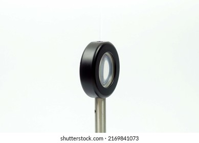 A Lens Mount For Adjust Focus Of The Laser Beam Light.