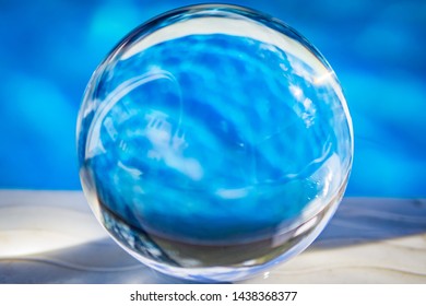 Lens Refractory Ball Reflecting Water In An Above Ground Pool