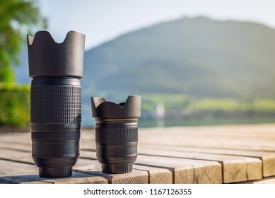 Lenses of photo camera standing in a row. Zoom tele lens and wide angle lens with fixed focal length from dslr camera