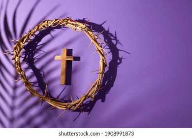 Lent season, Holy week and Good friday concept. Crown of torns and cross on purple background