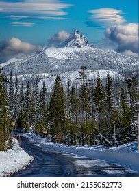 Lenticular Clouds Over Snow Covered Three Fingered Jack Mountain And Access Road To Hoodoo Ski Area In The Central Oregon Cascade Mountains