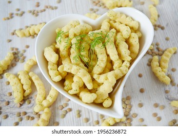 Lentil Chips On Wooden Surface