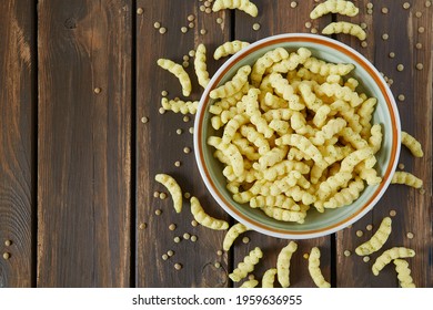 Lentil Chips On Wooden Surface