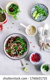 Lentil Salad With Roasted Beetroot, Arugula, Parsley Herb, And Pomegranate Seeds With Tahini, Honey Lemon Dressing With Copy Space. Healthy Vegan Salad Recipe Concept. Top View Salad Image.