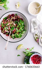 Lentil Salad With Roasted Beetroot, Arugula, Parsley Herb, And Pomegranate Seeds With Tahini, Honey Lemon Dressing With Copy Space. Healthy Vegan Salad Recipe Concept. Top View Salad Image.