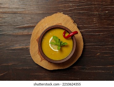 Lentil Soup With Roasted Mint And Hot Pepper. Turkish Cream Chickpea Soup. Top View On A Wooden Background