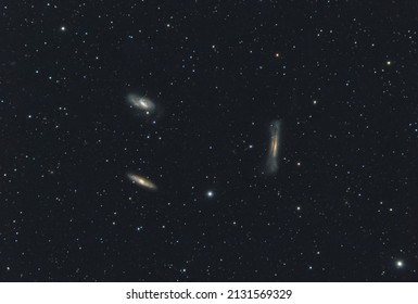 The Leo Triplet also known as the M 66 Group, a small group of galaxies in the  Leo constellation. This galaxy group consists of the spiral galaxies M 65, M 66, and NGC 3628