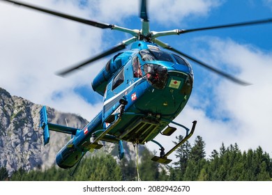 Leogang, Austria - July 15, 2014: Medical helicopter at airport and airfield. Rotorcraft and medicopter. General aviation industry. Air ambulance transportation. Air transport. Fly and flying.