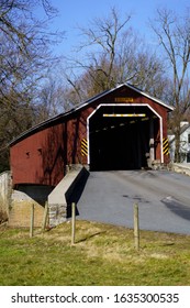 Leola, PA / USA – February 3, 2020: Pinetown Bridge is a red, 133 feet long covered bridge that spans the Conestoga River in Lancaster County.