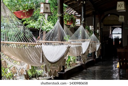 Leon, Nicaragua, September 2014: hammocks in a courtyard of a colonial hostel