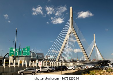 Leonard P. Zakim Bunker Hill Bridge over the Charles river in autumn in Boston Massachusetts USA.  The bridge is one of the widest cable bridges in the world.