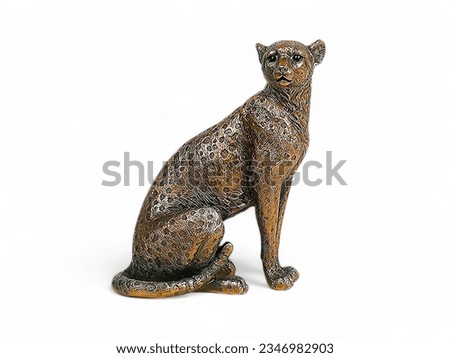 Leopard colored bronze animal statue on a white background