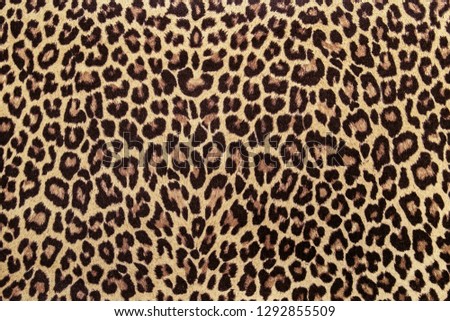 Leopard effect fabric pattern background sample. African style, leopard print, seamless. Cheetah or jaguar fabric texture. Animal skin textile design. Abstract cloth print.