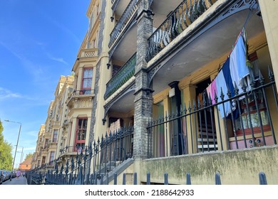 Leopold Buildings. Historic Tenement Block Of Flats In Bethnal Green, In The East End Of London. Located On Columbia Road. Capturing Everyday Life. Washing Line Outside A Window.