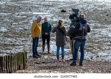 Lepe England - March 17 2022: John Craven being filmed for BBC Countryfile on the beach at Lepe Hampshire England