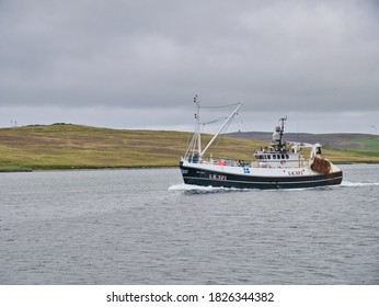 Lerwick, UK - Aug 22 2020: Arriving at Lerwick harbour, the Defiant (LK 371), a whitefish trawler built in 1987 - one of the Shetland fishing fleet and with a home port of Symbister, Whalsay.