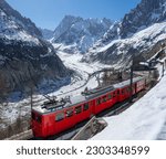 Les Grandes Jorasses peaks and Mer de Glace glacier. View of Vallee Blanche of the Mont Blanc massif with cogwheel train. Alps, Haute-Savoie, France