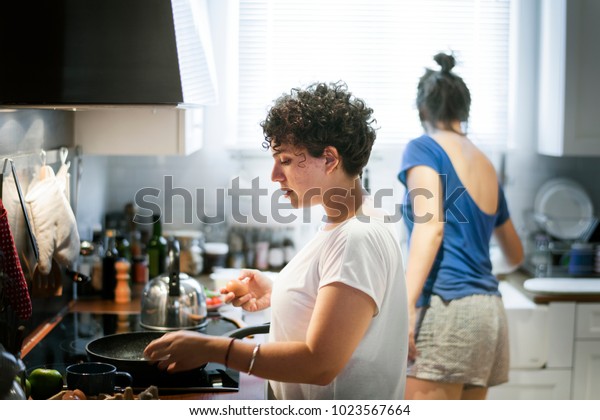 Lesbian Couple Cooking Kitchen Together Stock Photo Edit Now