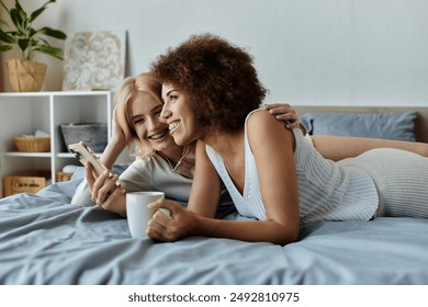 A lesbian couple in cozy homewear shares a laugh while enjoying their morning routine. - Powered by Shutterstock