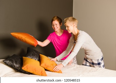 Lesbian Couple Make The Bed In The Morning, Horizon Format