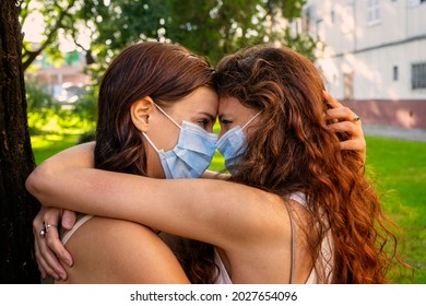 Lesbian Couple With Mask In The Park