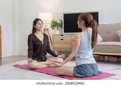 Lesbian Couple Meditating and Connecting Through Yoga - Powered by Shutterstock