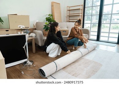 Lesbian Couple Moving into New Home - LGBT Family Unpacking and Decorating Modern House Together - Powered by Shutterstock