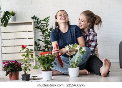 A Lesbian Couple Planting Flowers Together For Their Home.