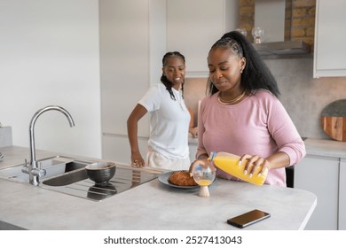 Lesbian couple preparing breakfast in kitchen - Powered by Shutterstock