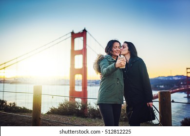 Lesbian Couple Taking Selfie At Golden Gate Bridge Shot With Lens Flare And Selective 