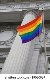 Lesbian, Gay, Bisexual, And Transgender Pride Flag Flying Outside A Government Building