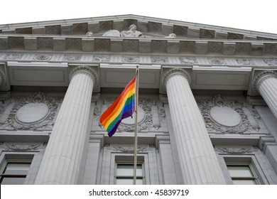 Lesbian, Gay, Bisexual, And Transgender Pride Flag Flying Outside A Government Building