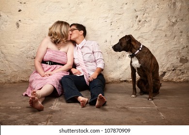 Lesbian Kissing Couple On Floor With Pet Dog Watching