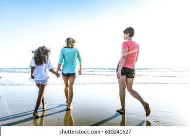 Lesbian Mothers With Adopted Child - Happy Homosexual Family Playing With Her Daughter