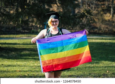 Lesbian Nursing Student Graduate Holds Gay Pride Rainbow Flag