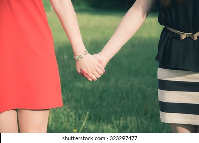 Lesbians Holding Each Other Hands In Vintage Style. 