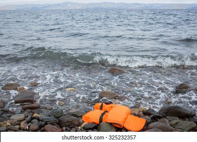 Lesbos, Greece - September 29, 2015: A Life Vest Used By Refugees Can Be Seen On The Shore 