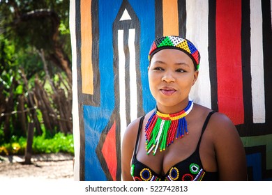 Lesedi Cultural Village, SOUTH AFRICA - 4 November 2016: Young Zulu woman in colourful traditional bead work costume.