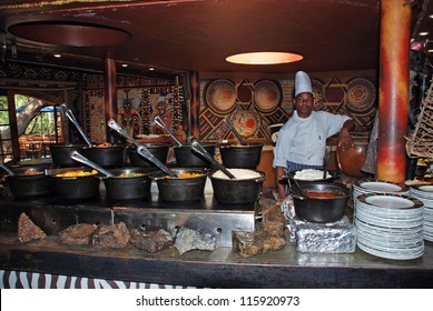 LESEDI ,SOUTH AFRICA-JAN 1:African cook in tribal restaurant cooking african ethnic food,exotic specialities,meat,vegetable and "mieliepap"on January 01,2008 in Lesedi  Cultural village,South Africa.