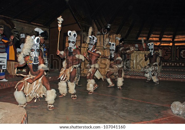 LESEDI VILLAGE, SOUTH AFRICA - DECEMBER 01: A\
group of South African Zulu dancers in ritual costumes entertaining\
for tourists on December 01, 2008 at the Cultural Village Lesedi,\
South Africa.