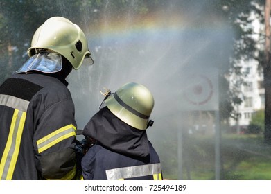 lesson for a child in putting out a fire - Powered by Shutterstock