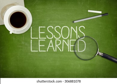 Lessons learned concept on green blackboard with coffee cupt and paper plane