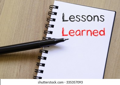 Lessons learned text concept write on notebook